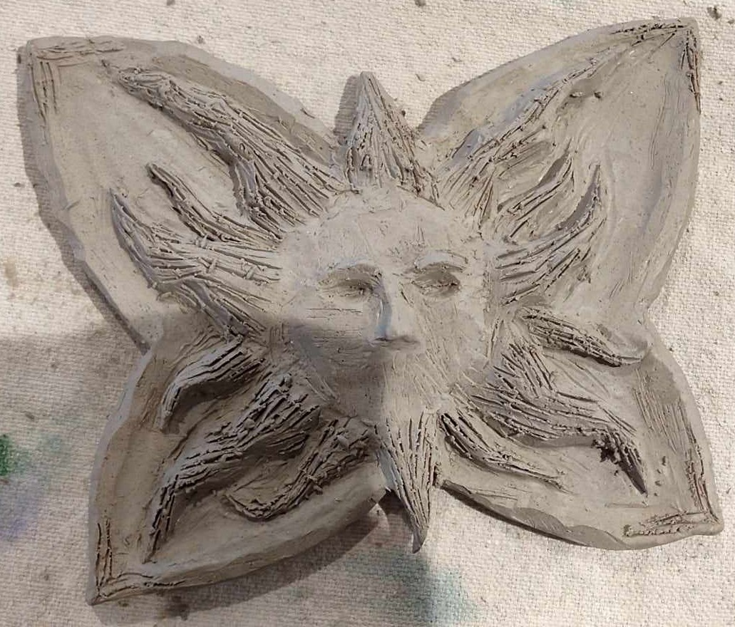 Winged Sun clay sculpture in progress